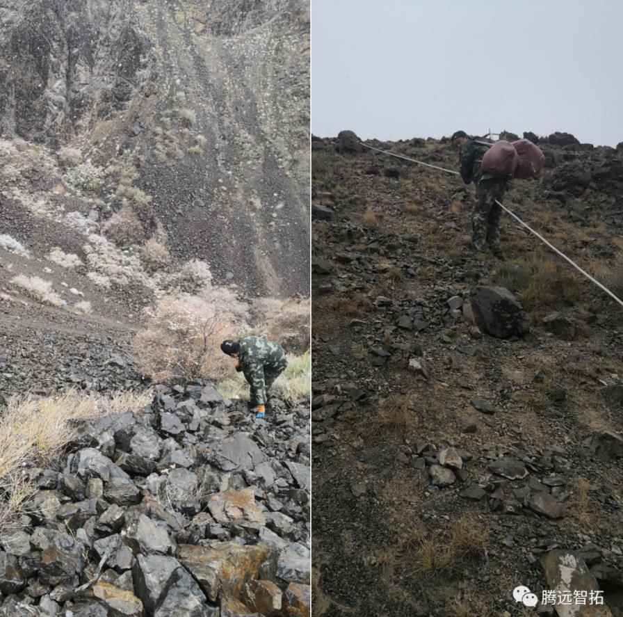 工作人员在陡峭的山上艰难的前进